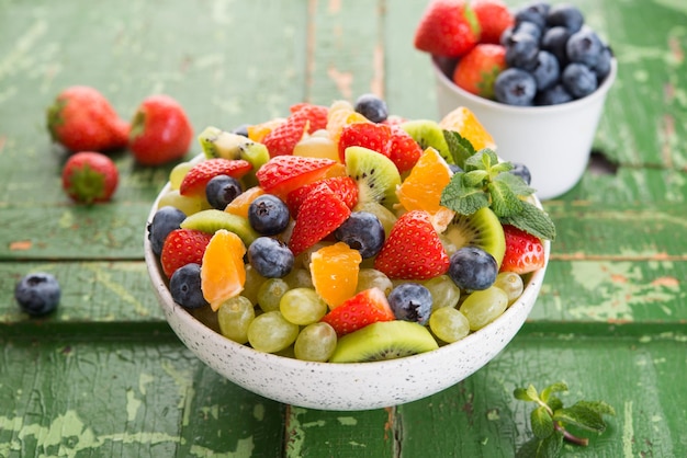 Fresh fruit salad, blueberries, strawberries, grapes, kiwi, orange. Selective focus