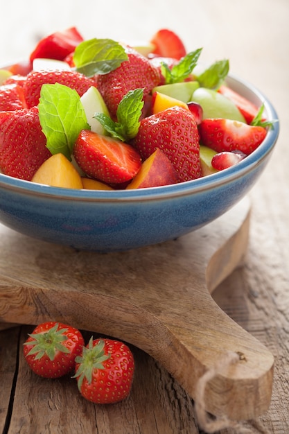 Fresh fruit salad with strawberry, apple, nectarine, pomegranate