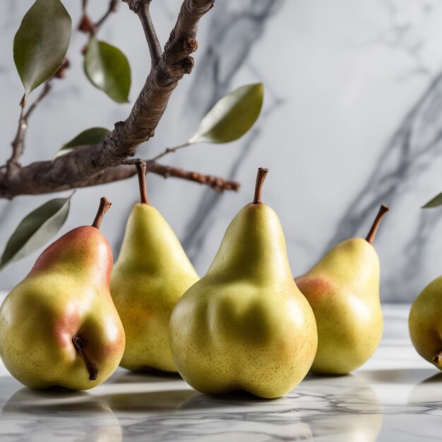 Fresh fruit slice and whole pears next to a decorative branch on marble background