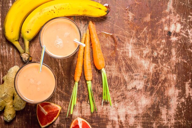 Fresh fruit smoothie . On rustic background