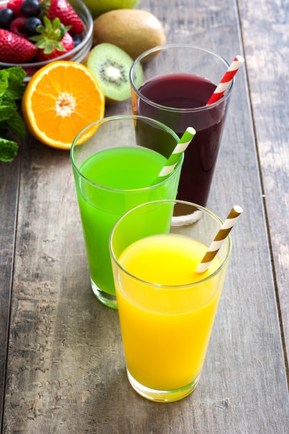 Fresh fruit smoothies on rustic wooden table