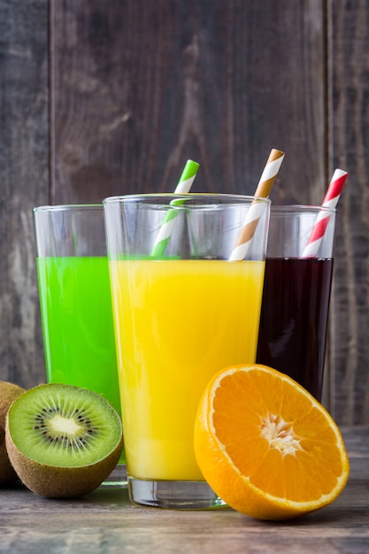 Fresh fruit smoothies on rustic wooden table