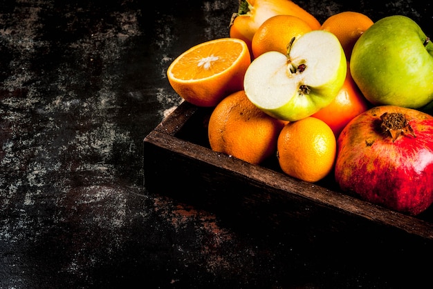 Fresh fruit variety in wooden tray