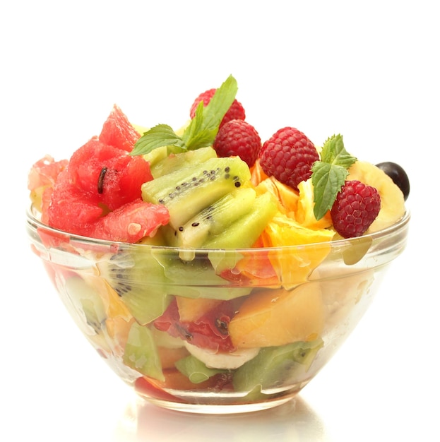 Fresh fruits salad in bowl isolated on white