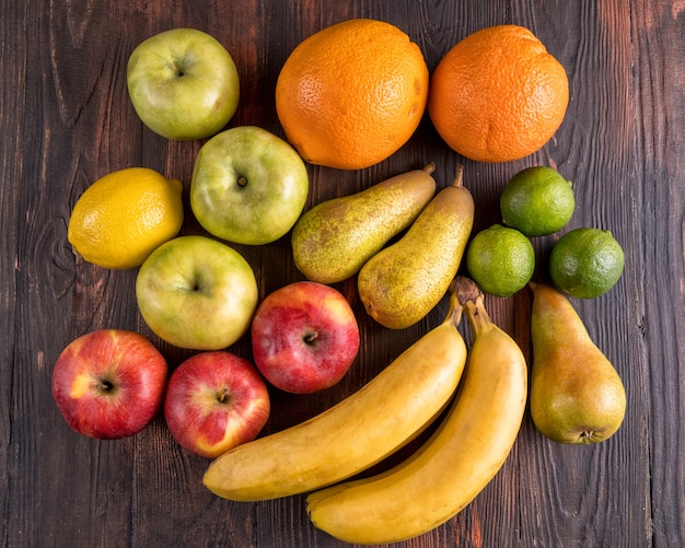 Fresh fruits on wooden table.