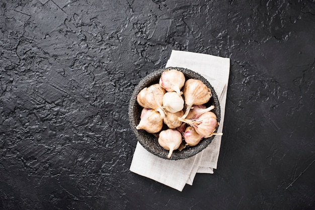 Fresh garlic on black  background