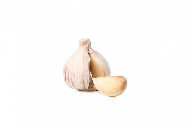 Fresh garlic bulb and slice isolated on white