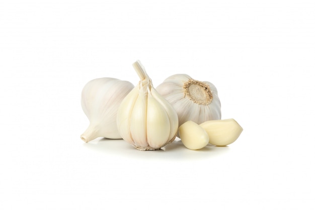 Fresh garlic bulbs and slices isolated on white