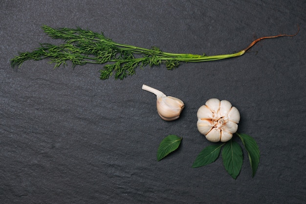 Fresh garlic. Garlic Bulb on black stone table.