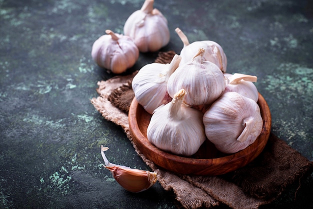 Fresh garlic on green background