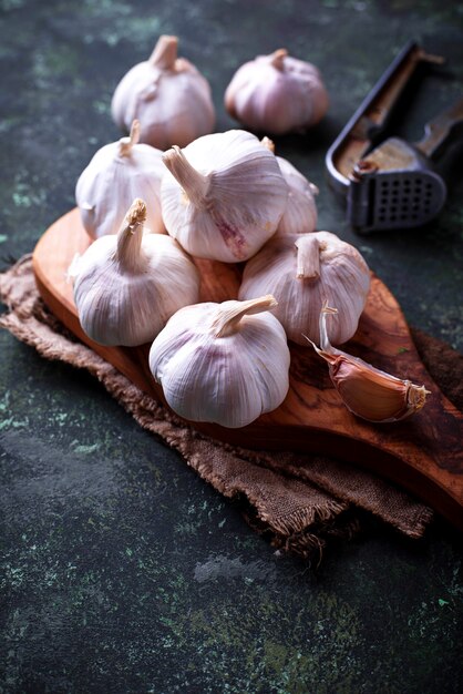 Fresh garlic on green background