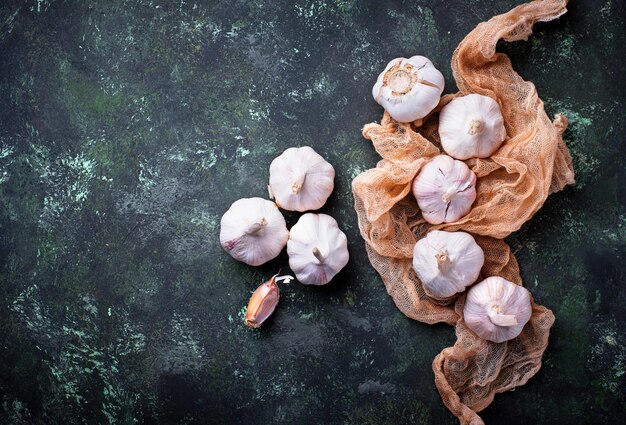 Fresh garlic on green background