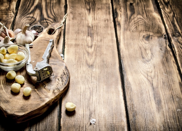 Fresh garlic on old wooden Board