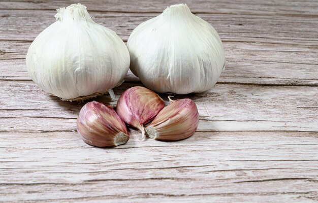 Fresh garlic on rustic wooden table Garlic cloves