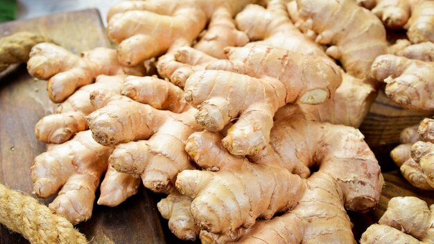 Fresh ginger root Foods containing vitamin C Free space for text on a stone background