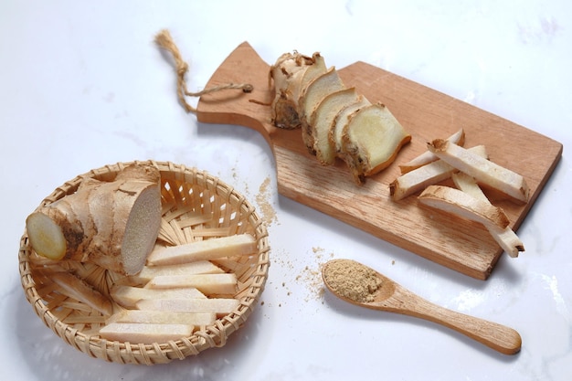 fresh of ginger with palm sugarbandrek ingredient on white background