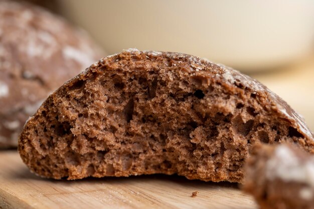 Fresh gingerbread and a glass of cold milk fresh cow's milk poured into a glass and chocolate gingerbread