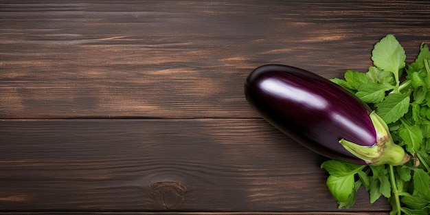 Photo fresh glossy eggplant on wood table flat lay with room for text