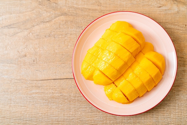 fresh and golden mango sliced on plate