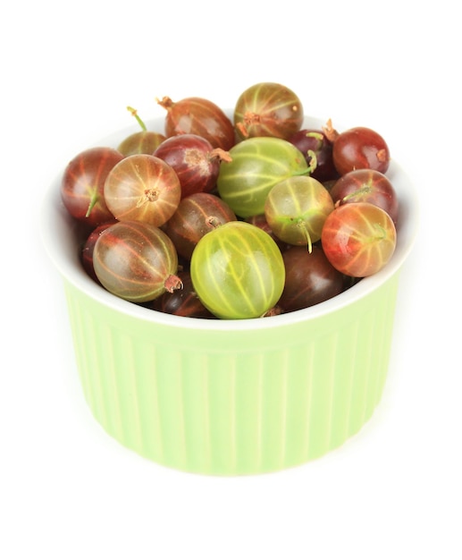 Fresh gooseberries in bowl isolated on white