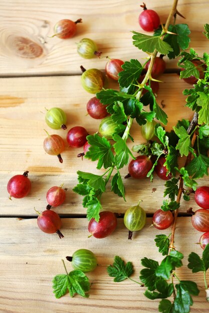 Fresh gooseberries on a wooden surface