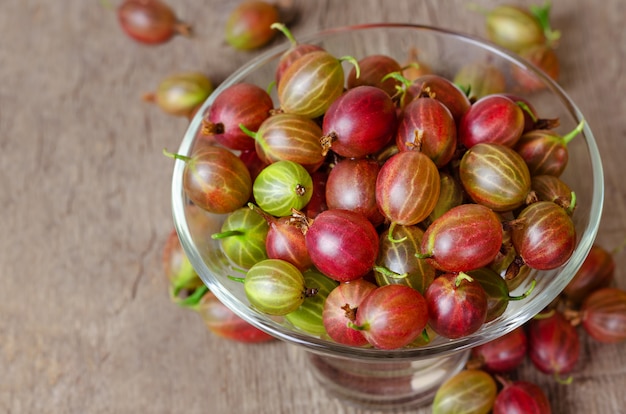 Fresh gooseberry on wooden table