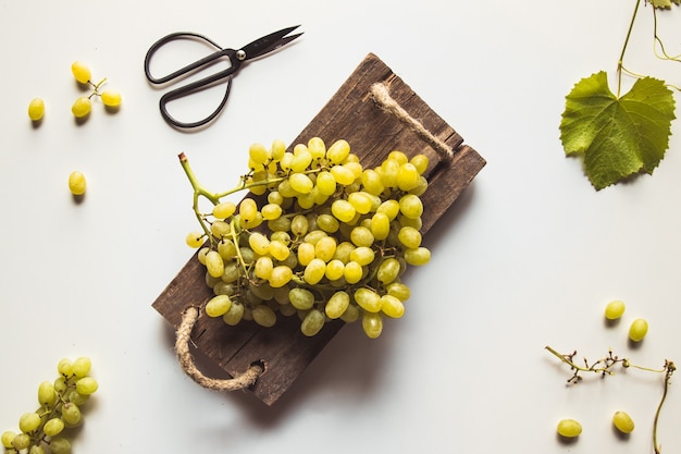 Fresh grape on cutting board.