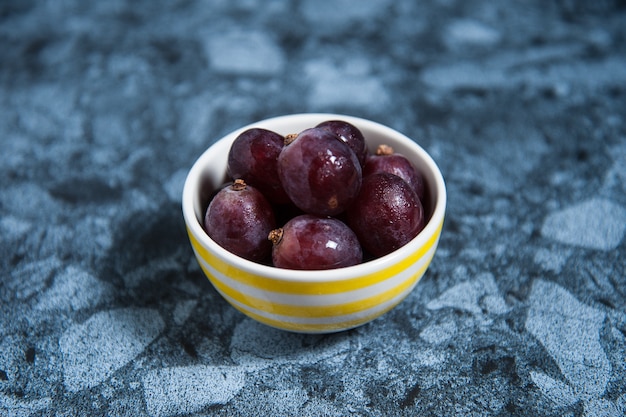 Fresh grape fruits on marble table. Flat lay.