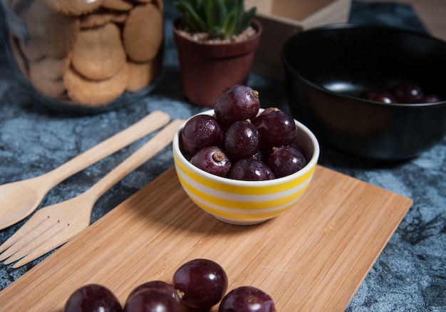 Fresh grape fruits on marble table. Flat lay.