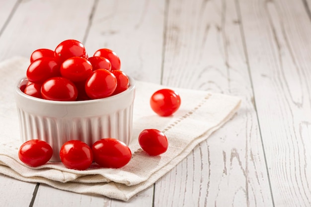 Fresh grape tomatoes in a bowl on the table