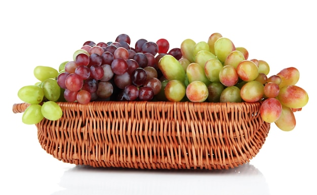 Fresh grape in wicker basket isolated on white