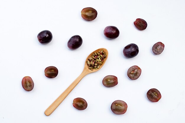 Fresh grape with seeds on white background