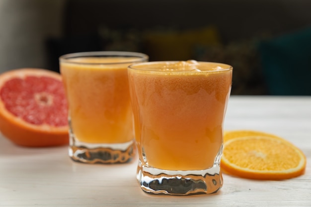 Fresh grapefruit on a white wooden table