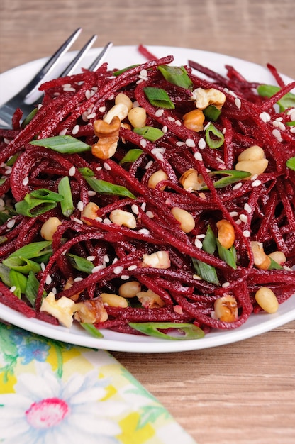 Of fresh grated   beets, onions flavored with nuts and sesame seeds