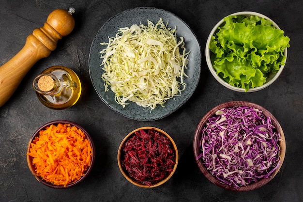 Fresh grated vegetables in bowls on the table Healthy food