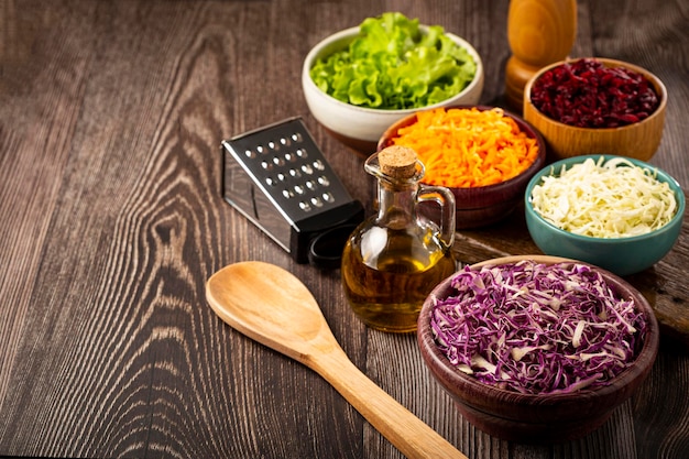 Fresh grated vegetables in bowls on the table Healthy food