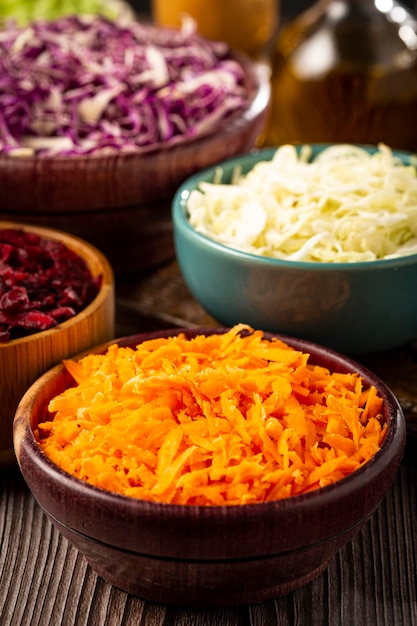 Fresh grated vegetables in bowls on the table Healthy food