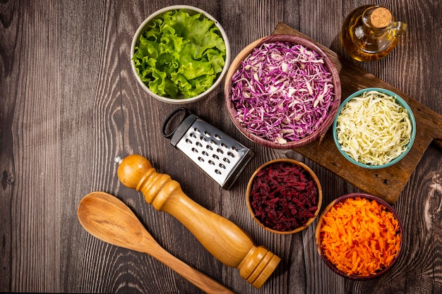 Fresh grated vegetables in bowls on the table Healthy food