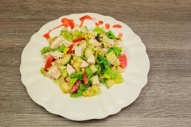 Fresh Greek salad in a bowl, top view