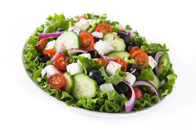 Fresh Greek salad in Plate with black olive,tomato,feta cheese, cucumber isolated on white background.