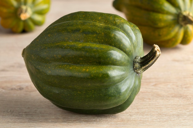 Fresh green acorn squash close up in autumn