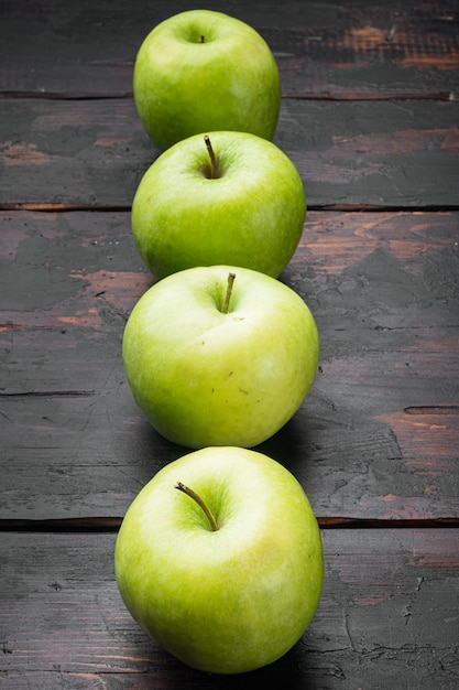 Fresh green apples set, on old dark rustic table background