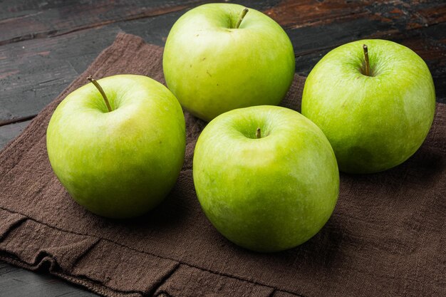 Fresh green apples set, on old dark rustic table background