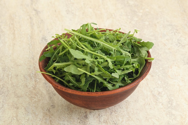 Fresh green arugula in the bowl