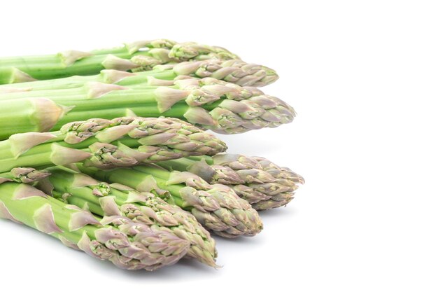 Fresh green asparagus on white