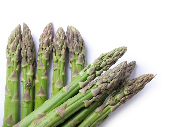 Fresh green asparagus on white