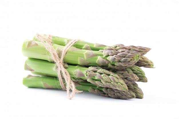 Fresh green asparagus on white