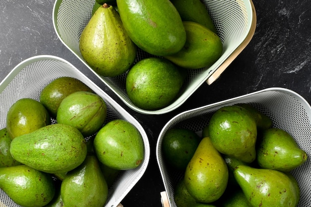 Fresh Green Avocados In Baskets with Dark Mood