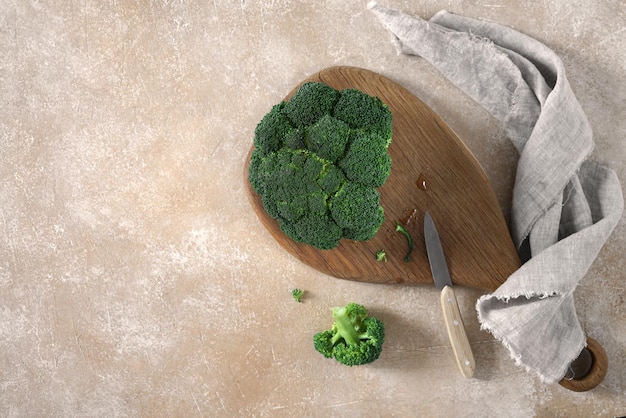 Fresh green broccoli on a cutting desk on table Top view Free copy space