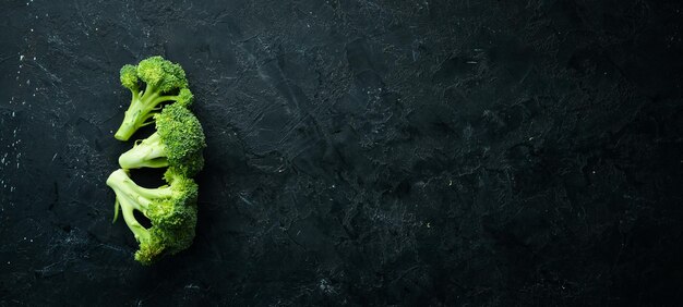 Fresh green broccoli on dark old background Top view Free space for your text